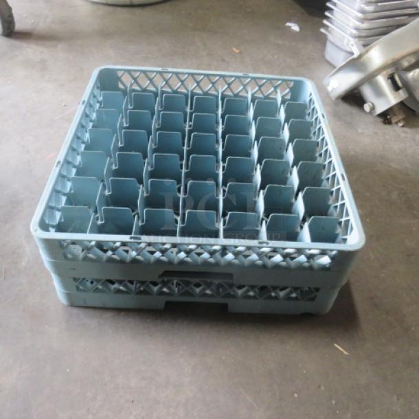 Blue dishwasher rack, model 2XBID, with multiple compartments, sturdy plastic, good condition, ideal for commercial use.