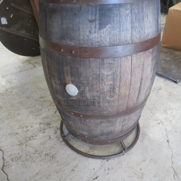 Whiskey barrel bar height table, 41x42 inches, rustic wood with metal bands, circular base. Excellent condition.
