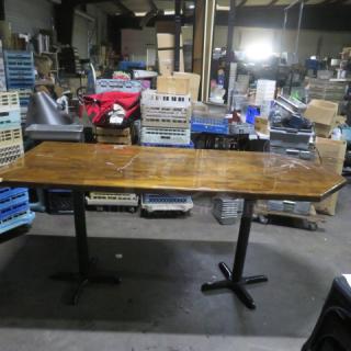Wooden table top on dual bar height base, dimensions 72x36x43 inches. Good condition with visible wood grain.