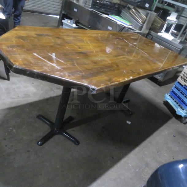 Wooden tabletop on dual bar height base, 84x36x43 inches. Shows wear with scratches and scuffs. Suitable for refurbishing.