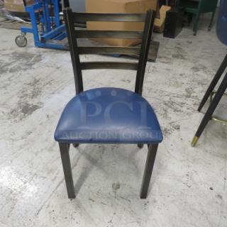 Metal Chair With A Blue Cushioned Seat. 2XBID - Item #1219176