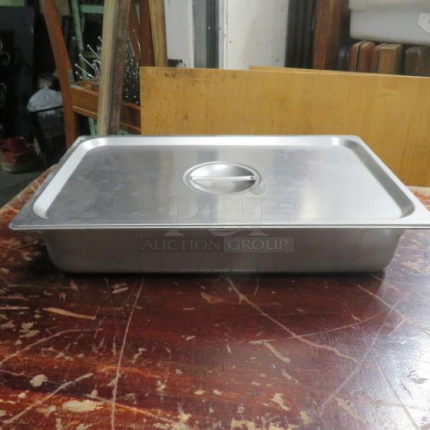 Full-size 4-inch deep stainless steel hotel pan with lid, used condition.