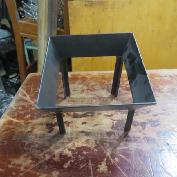 New black metal holder, dimensions 6.5x6.5x6 inches. Square shape with sturdy legs. Item code: 6XBID.