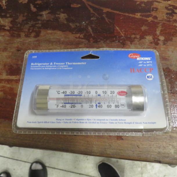 New Cooper Atkins thermometer in packaging, model 335, measures -40 to 80°F, non-toxic, suitable for refrigerators/freezers.