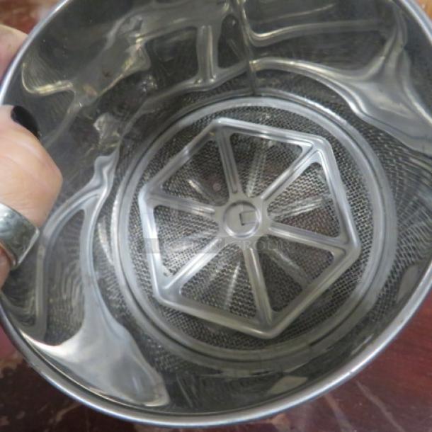 New stainless steel sifter, polished finish, fine mesh, durable construction, shown from above for interior detail.