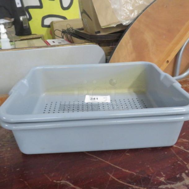 Gray perforated bussing tub with handles, labeled "341," in used condition. Suitable for efficient draining tasks.