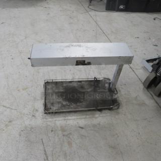 Commercial food warmer, 120 volt, metallic finish, visible wear, rectangular heat lamp, suitable for buffet or catering use.