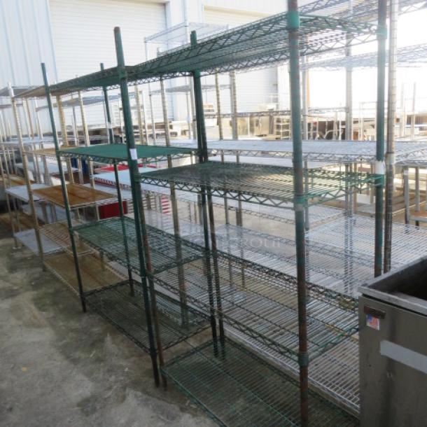 Green Metro shelf unit with 4 wire shelves, 48x18x75 inches. Used condition, metal construction, ideal for storage.