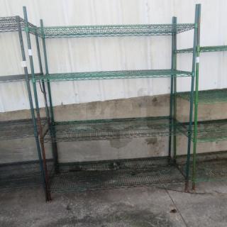 Green Metro shelf with four wire shelves, 60x18x75 inches. Visible wear, suitable for storage or display.