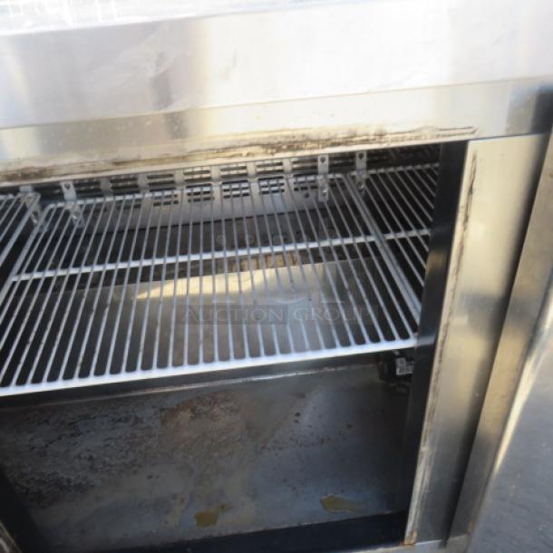 Blue Air 3-door worktop refrigerator BLUR72, with 3 racks, 72x30x36 inches, on casters. Requires 115 volts. Condition shows use.