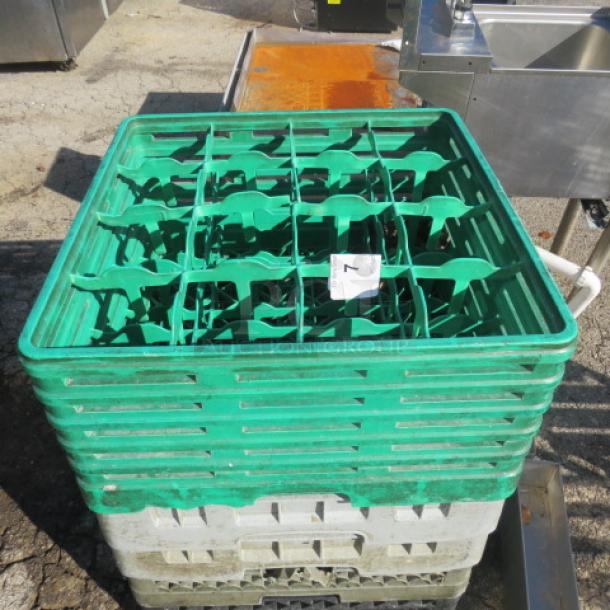 Green plastic dishwasher rack, stackable design, used condition. Number label visible on the side. Suitable for commercial use.