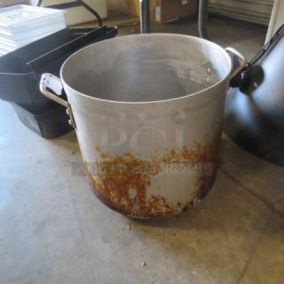 Large aluminum stock pot with side handles, showing rust and wear. Suitable for heavy-duty cooking or industrial use.