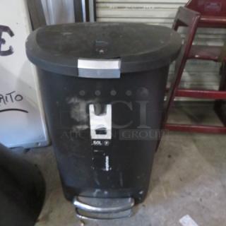 Black 13.2-gallon step trash can with lid and foot pedal, visible signs of use, silver lid handle, and 50L marking on the front.