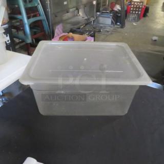 One half-size, 6-inch deep food storage container with lid; clear plastic, used condition.