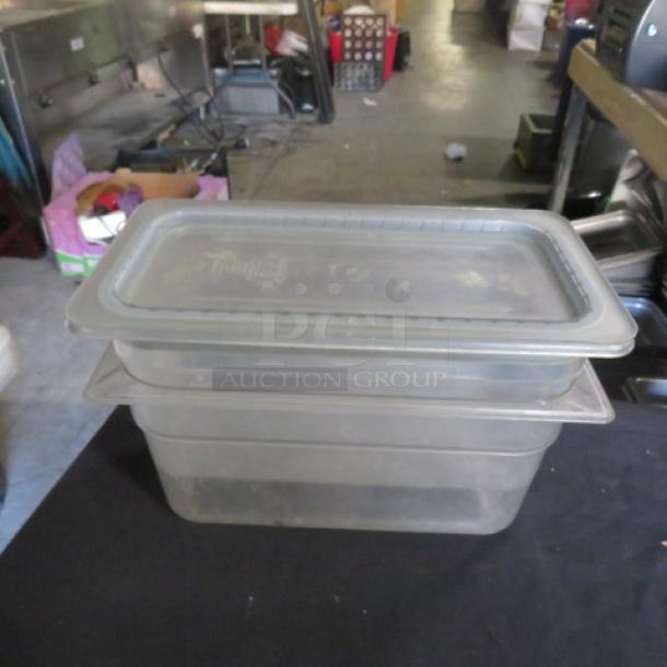 1/3 size 6-inch deep food storage container with lid. Clear plastic, used condition. Ideal for kitchen storage.