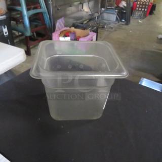 Clear 1/6 size, 6-inch deep food storage container; durable plastic, used condition, ideal for kitchen organization.