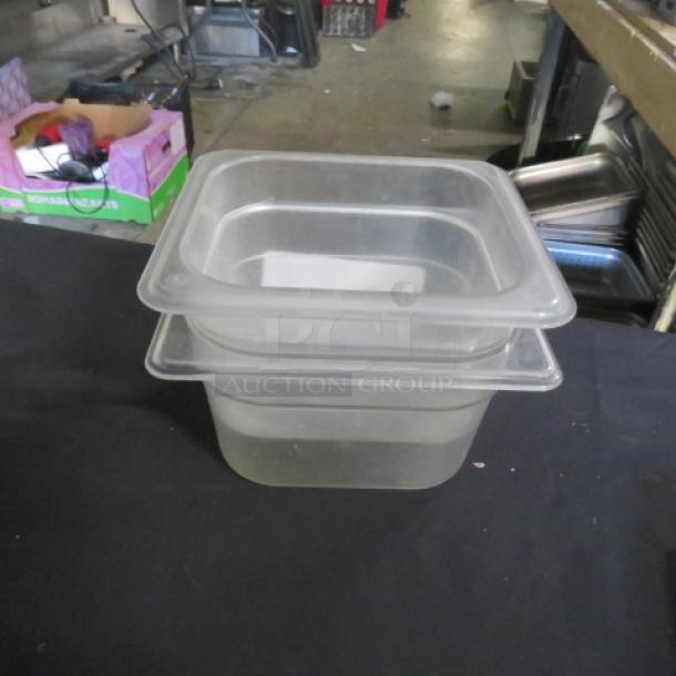 1/6 size, 4-inch deep food storage container, clear plastic, stackable, lightly used, suitable for kitchen or restaurant use.