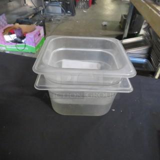 1/6 size, 4-inch deep food storage container, clear plastic, stackable, lightly used, suitable for kitchen or restaurant use.