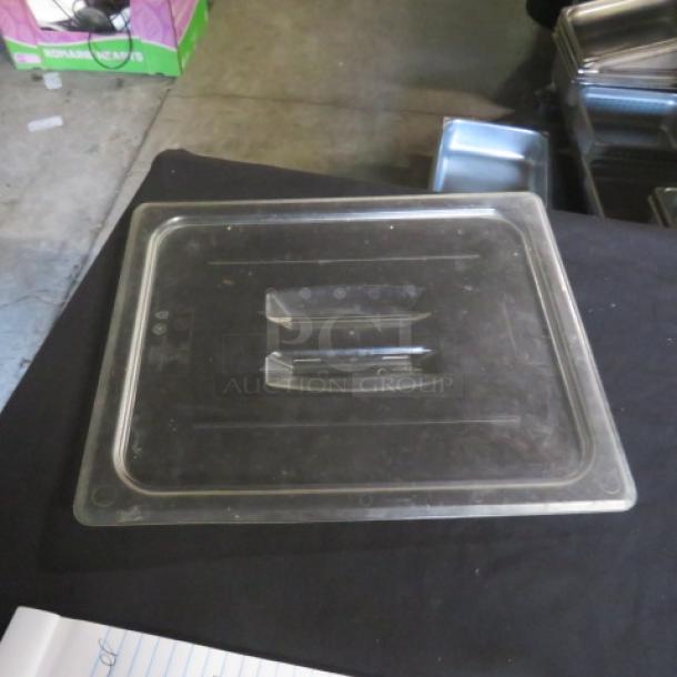 Clear 1/2 size food storage lid, model 5XBID, in good condition. Durable plastic with integrated handles.