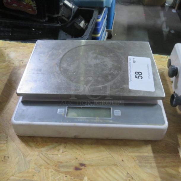 CDN Kitchen Scale, Model SD5502, stainless steel platform, digital display, used condition with visible wear.
