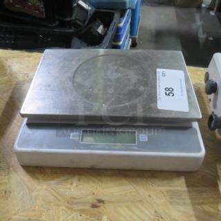 CDN Kitchen Scale, Model SD5502, stainless steel platform, digital display, used condition with visible wear.