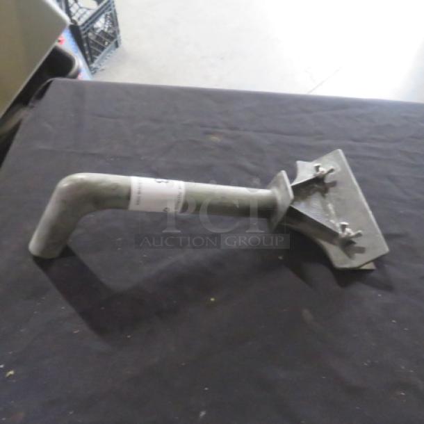 Griddle scraper with metal handle and angled blade, light wear, paper label indicating item number.