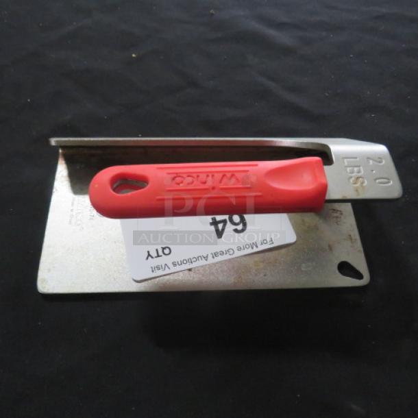Red-handled Winco steak weight, 2 lbs, in used condition, with label indicating auction item 64.