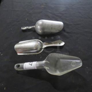 Assorted metal and plastic scoops, varying sizes. Visible label on plastic scoop reads "3XBID". Good condition.
