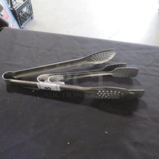 Assorted stainless steel tongs, set of three, in good condition, featuring perforated and scalloped tips for versatile use.