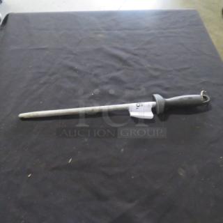 Steel knife sharpener with a black ergonomic handle, silver honing rod, and hanging loop, in good condition.