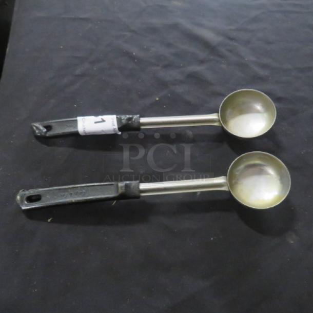Assorted set of two spoodles with stainless steel bowls and black handles, labeled "2XBID 1", in good condition.