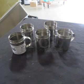 Stainless steel dredges, set of five, missing lids, reflective finish, with side handles, labeled "36".