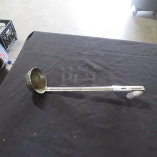 4oz stainless steel ladle, used condition, long handle. Marked "2XBID". Ideal for soups or sauces.