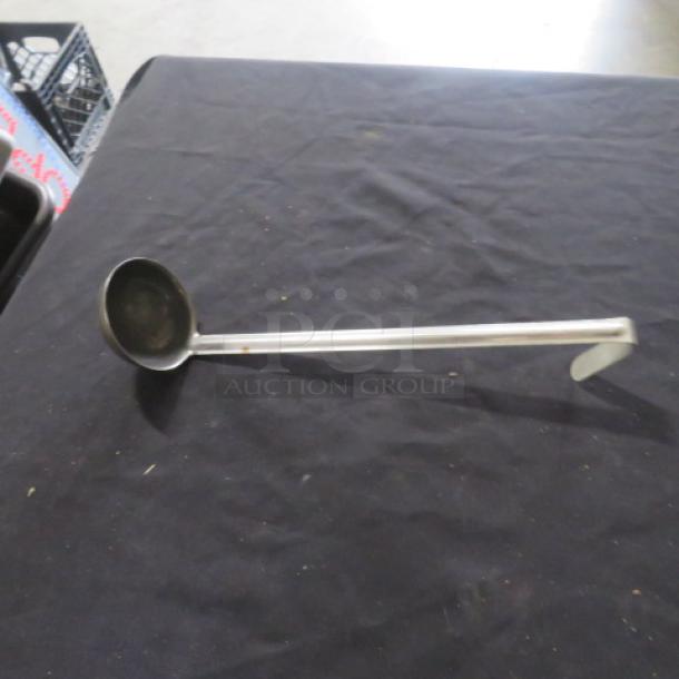 4oz stainless steel ladle with long handle, minimal wear; ideal for serving soups or sauces.