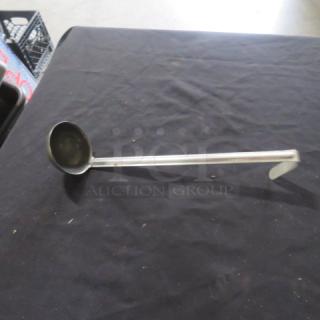 4oz stainless steel ladle with long handle, minimal wear; ideal for serving soups or sauces.