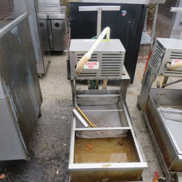 One 96lb oil filtration system on casters, Model 405, 120 Volt, features "Caution Hot" label, used condition.