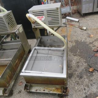 96lb oil filtration system on casters, Model 405, 120V. Features caution label and hose. Used condition.