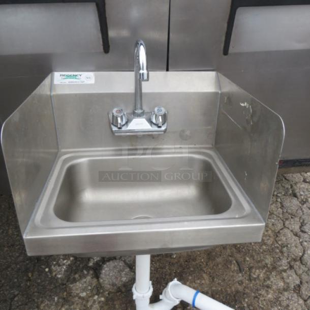 Regency stainless steel hand sink with faucet, includes left/right splash guards and backsplash, measures 17x15 inches.