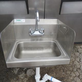 Regency stainless steel hand sink with faucet, includes left/right splash guards and backsplash, measures 17x15 inches.