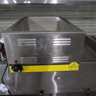 Qualite RDFW-1200NP food warmer, stainless steel, 120 Volt, visible control knob, good condition, branded label on front.