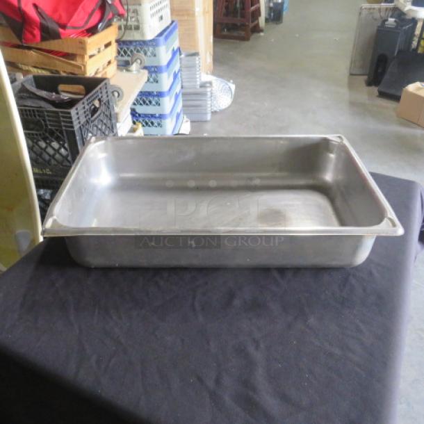 Stainless steel full-size 4-inch deep hotel pan, used condition, clean surface, ideal for commercial kitchen use.
