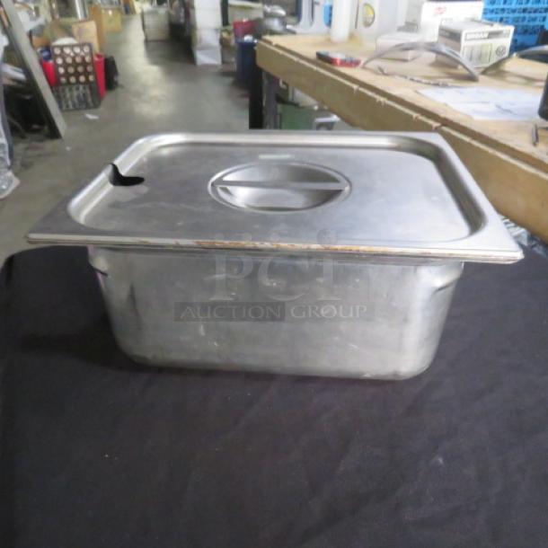 One half-size 6-inch deep hotel pan with lid, stainless steel, used condition.