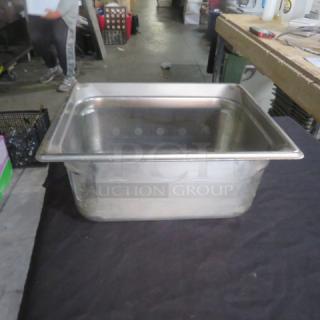 Half Size 6 Inch Deep Hotel Pan in stainless steel, used condition. Suitable for catering and food service. No visible labels.