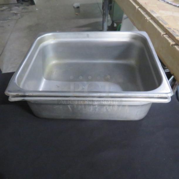 1/2 Size 4 Inch Deep Hotel Pan, stainless steel, stackable, used condition, ideal for catering and food service.