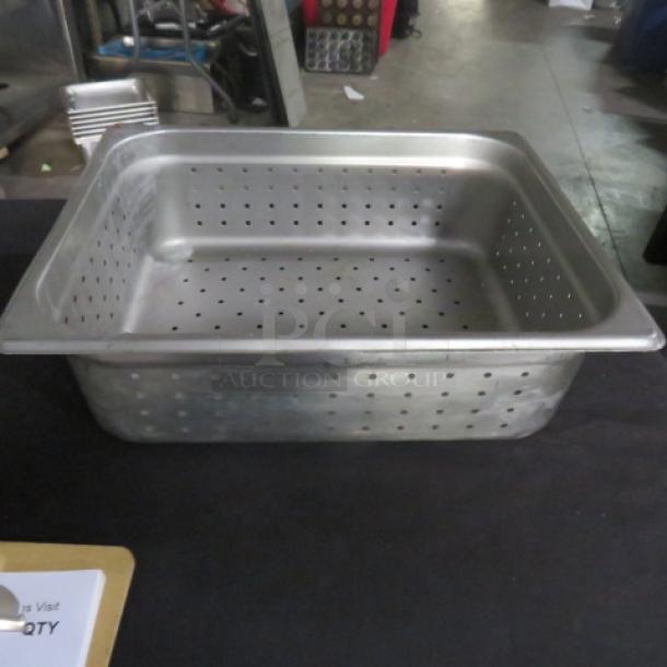 1/2 Size 4" Deep Perforated Hotel Pan, stainless steel, used, with visible perforations for drainage and steam cooking.