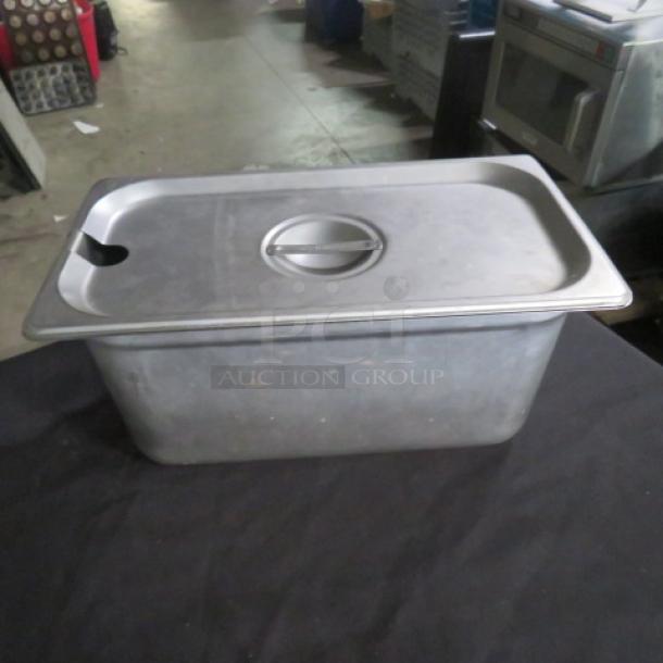 1/3 Size 6 Inch Deep Hotel Pan with Lid, stainless steel, shows light use. Ideal for commercial kitchens.