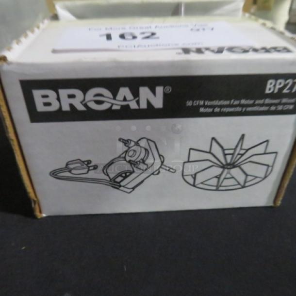 Broan fan motor and blower wheel model BP27 in original packaging. Box shows illustrations of the motor and wheel.