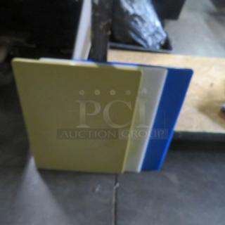 Assorted cutting boards, 15x20 inches, set of three in yellow, white, and blue, by 3XBID, in good condition.