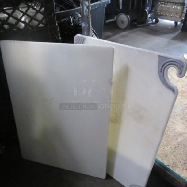 Assorted cutting boards, two pieces, 15x20 inches, white with decorative edges, in used condition.