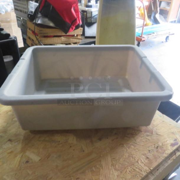 Beige plastic bussing tub in good condition, suitable for commercial use, with no visible tags or markings.